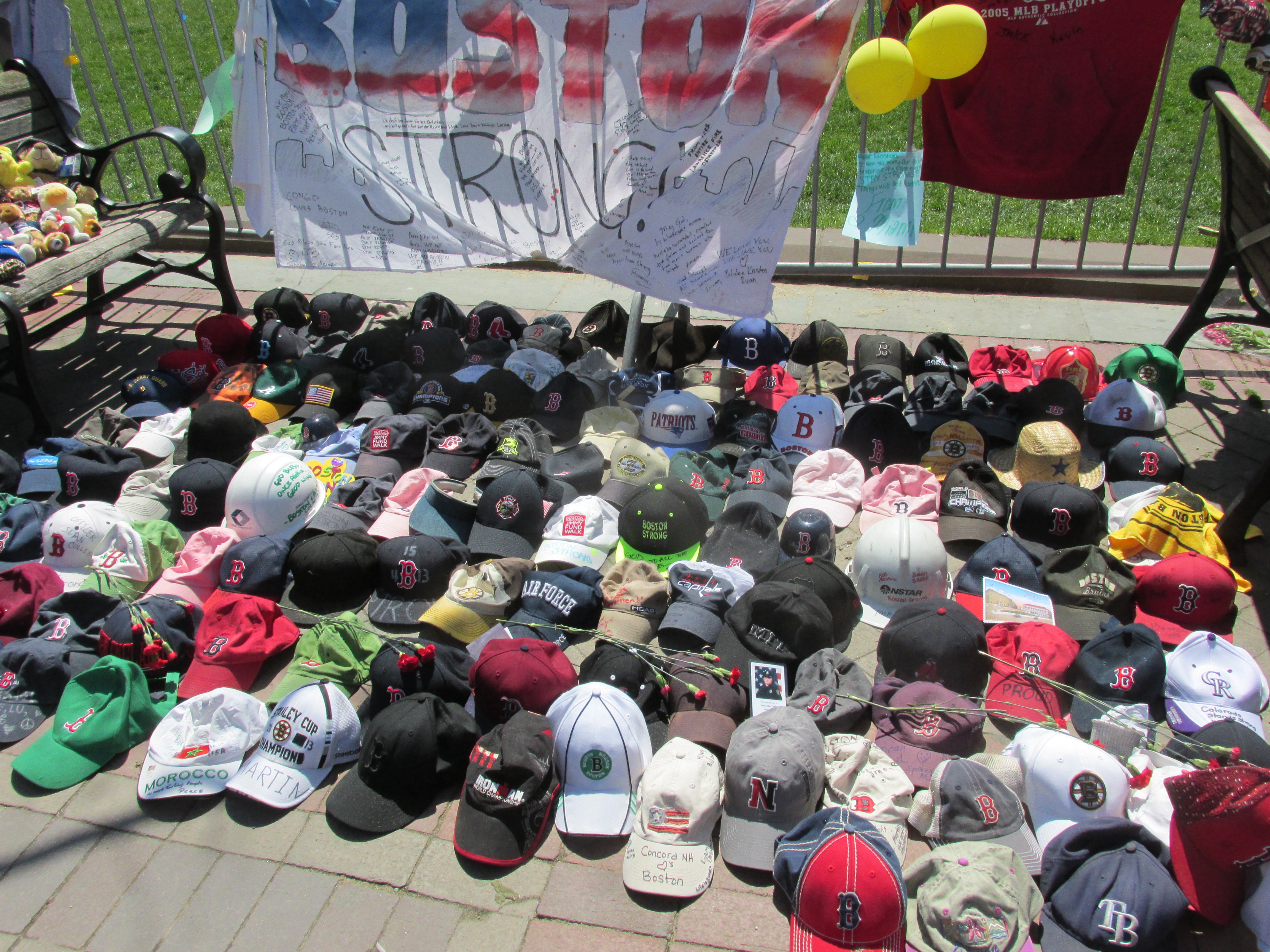 A collection of hats mark another part of the memorial.
