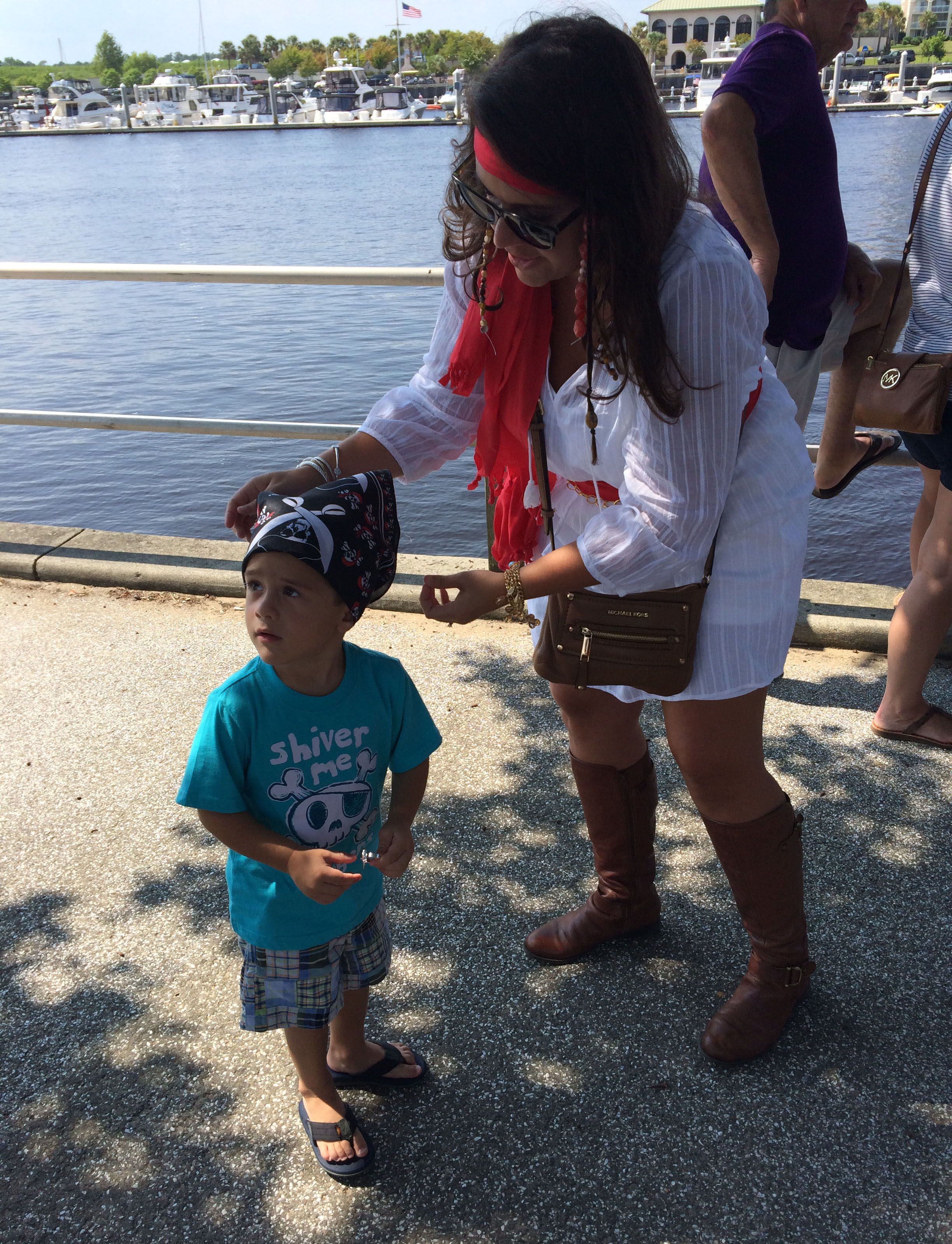 Sidney tying on the bandana of a soon-to-be pirate.