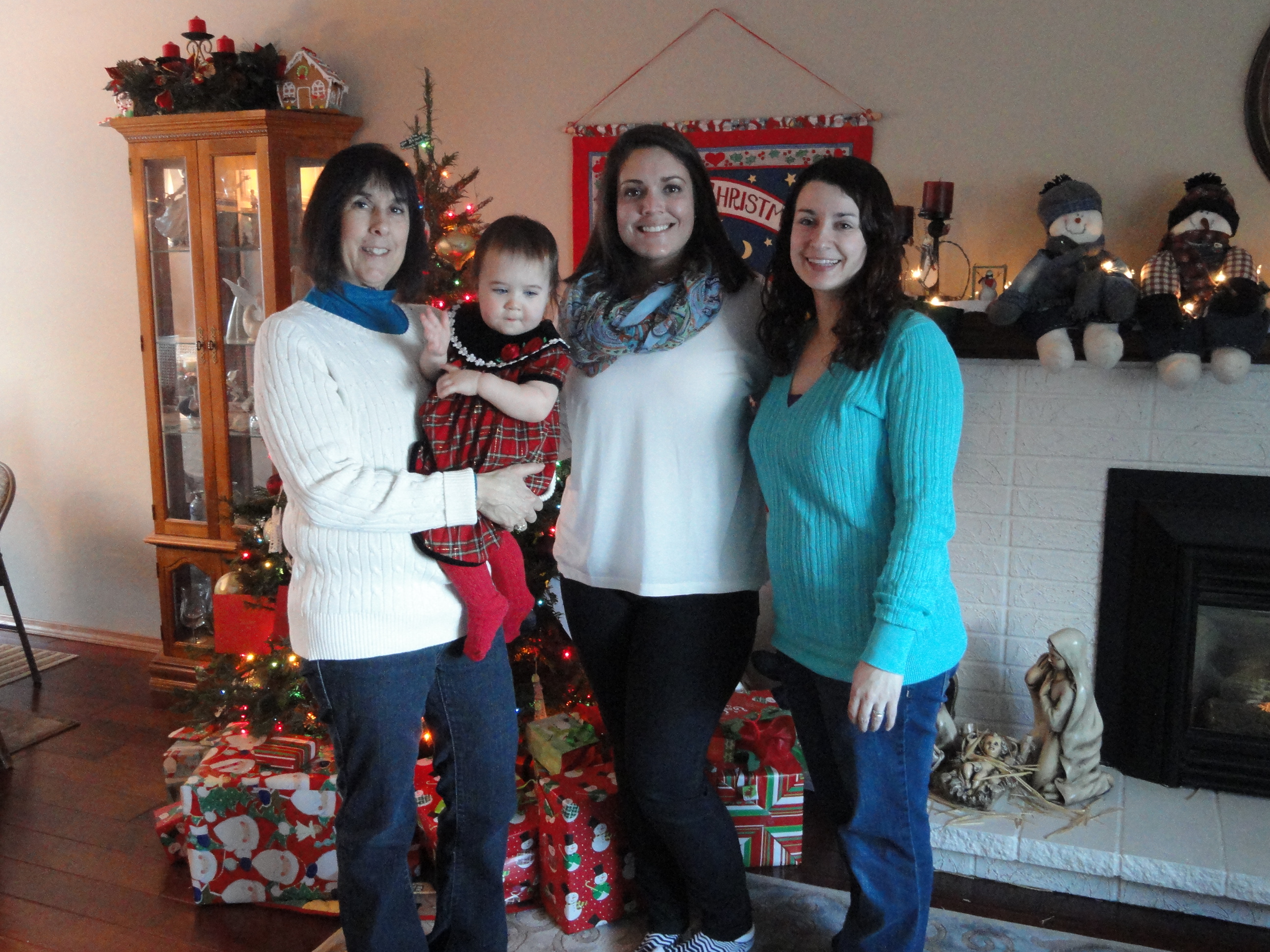 Sidney got to enjoy the holidays with my family. In this photo she is with my mom, my niece, and my sister.