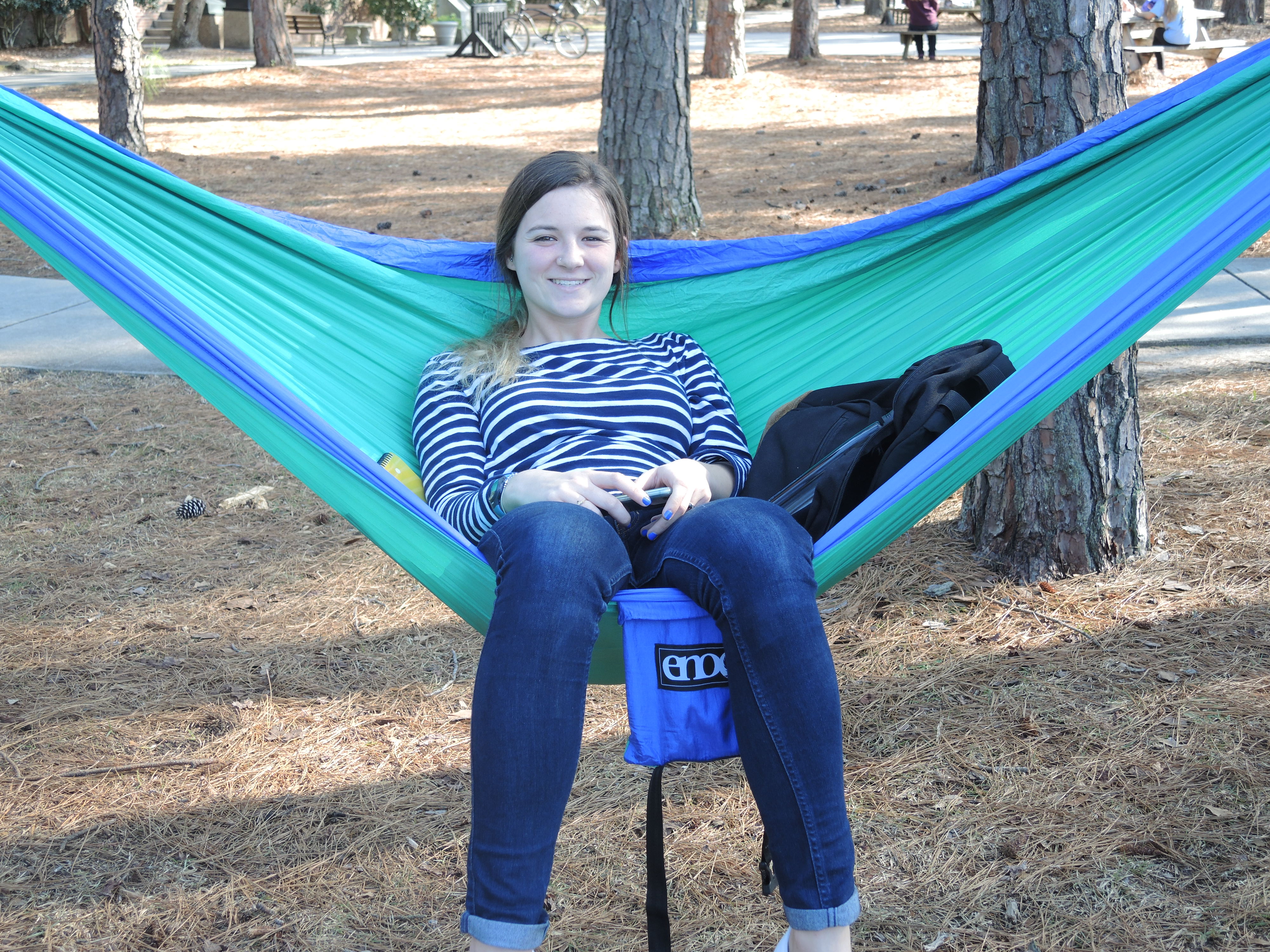 This student set up her hammock in the shade. Yes, there is a hammock club at Coastal.