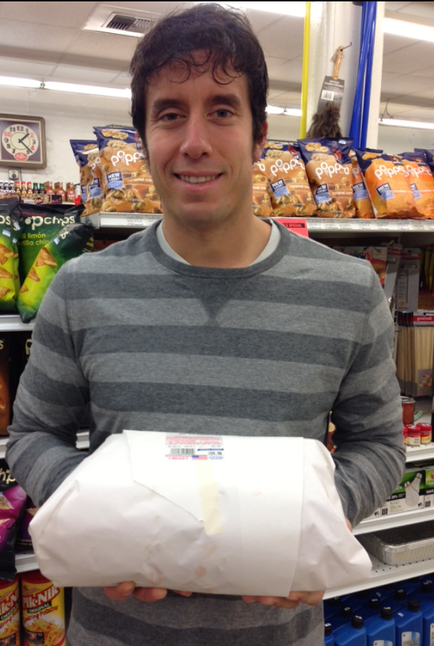 This is me holding our wrapped prime rib right before purchasing it at a Spokane deli called Sonnenberg's in December of 2013.