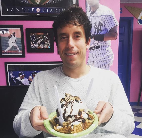 This is me at Meyer's Ice Cream Parlor (notice the Yankees memorabilia and pink walls in the background) enjoying one of their classic sundaes.