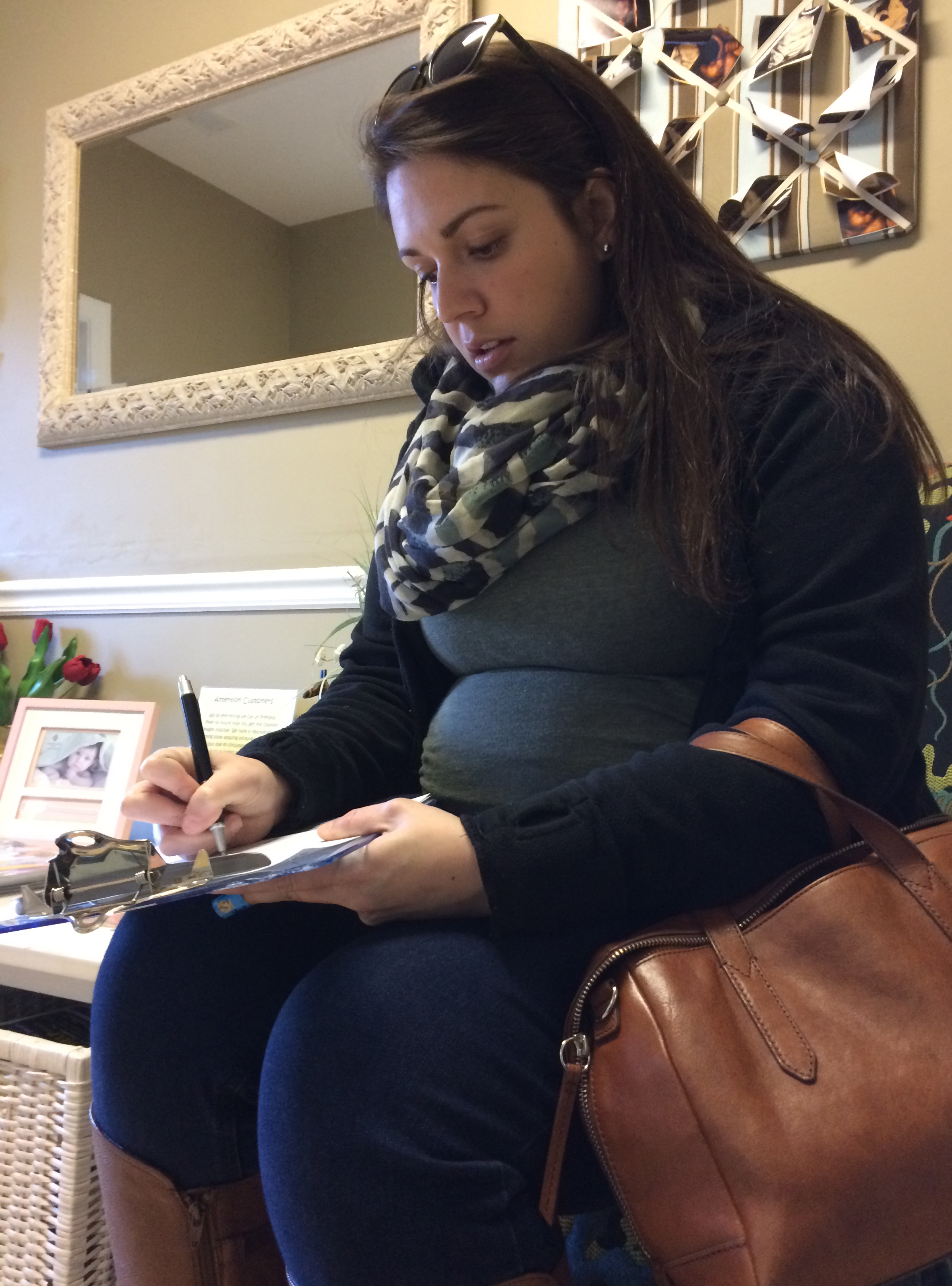 Sidney filling out paperwork at Prenatal Peek yesterday. It was just a short process and then right away we were in the ultrasound room.